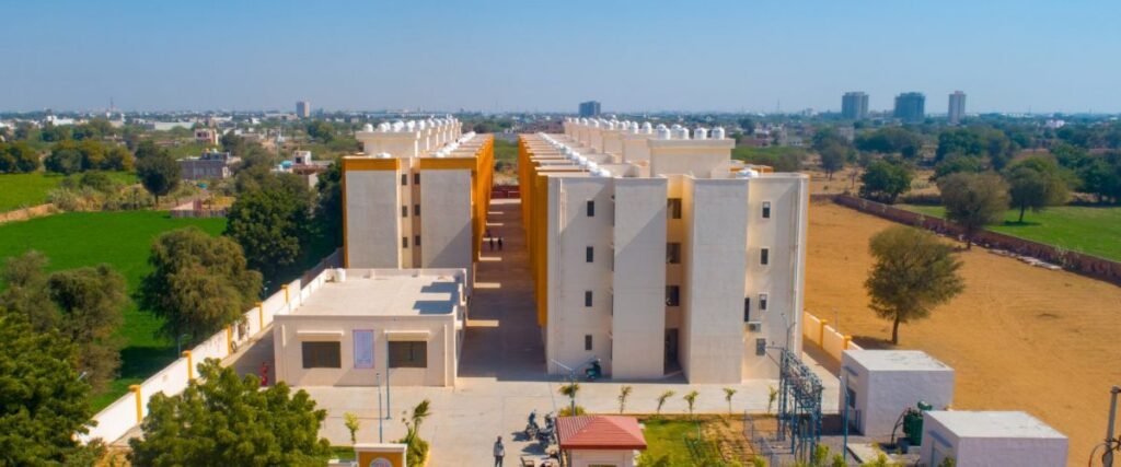 Aerial view of a large, modern apartment building with many architectural and architectural features.